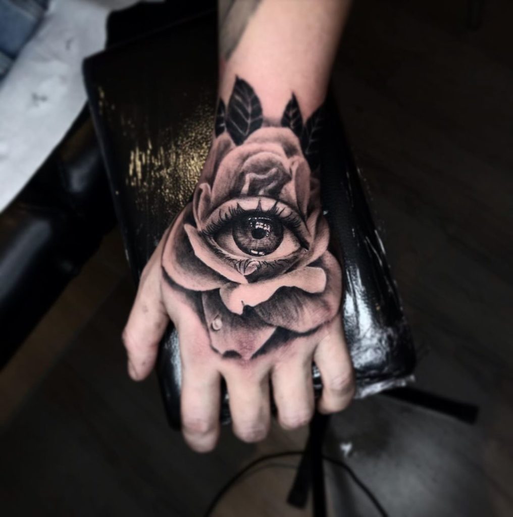 All the Piercings and Body Mods  Black rose hand tattoo by Mattwebbtattoo  on
